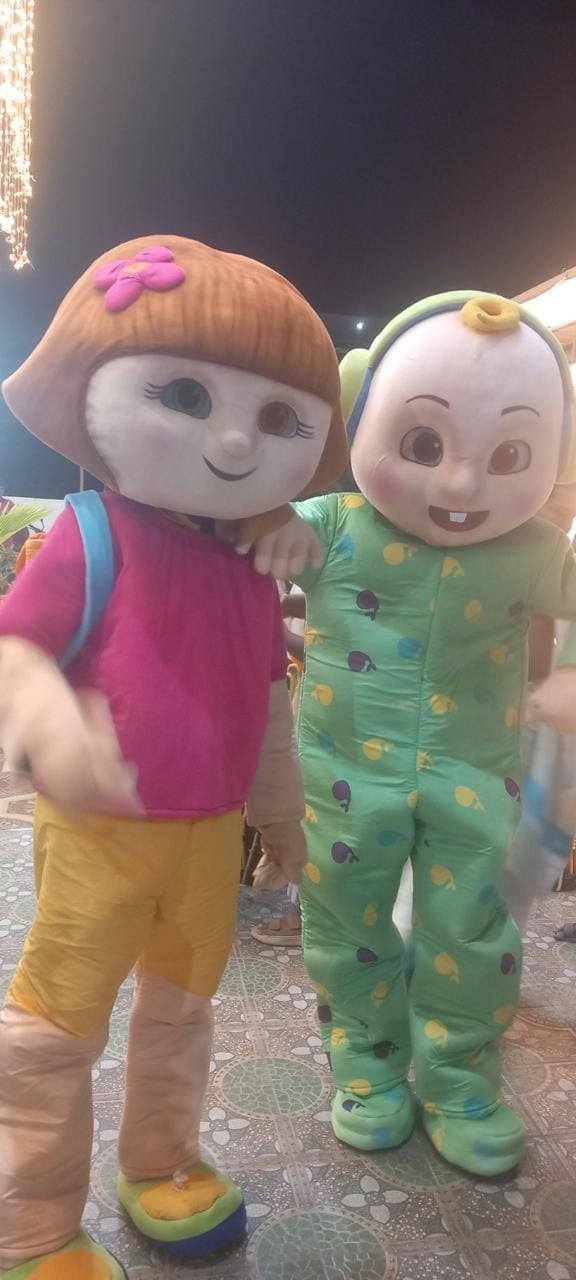 Cartoon mascots at a birthday party