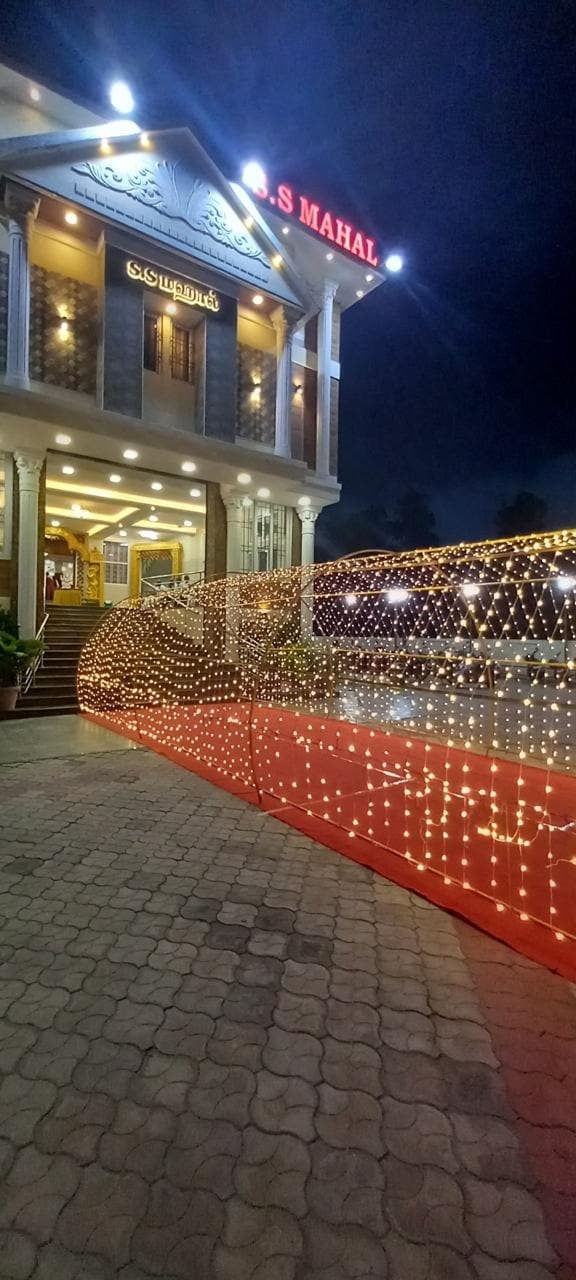 Fairy-light walkway at night at S.S Mahal