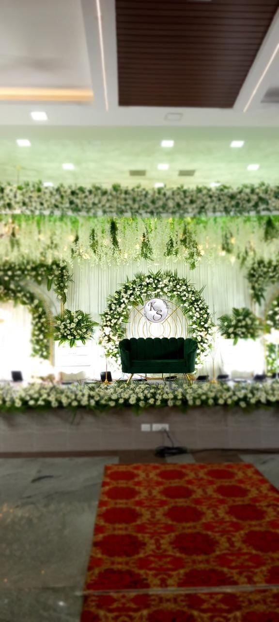 Green and white floral stage