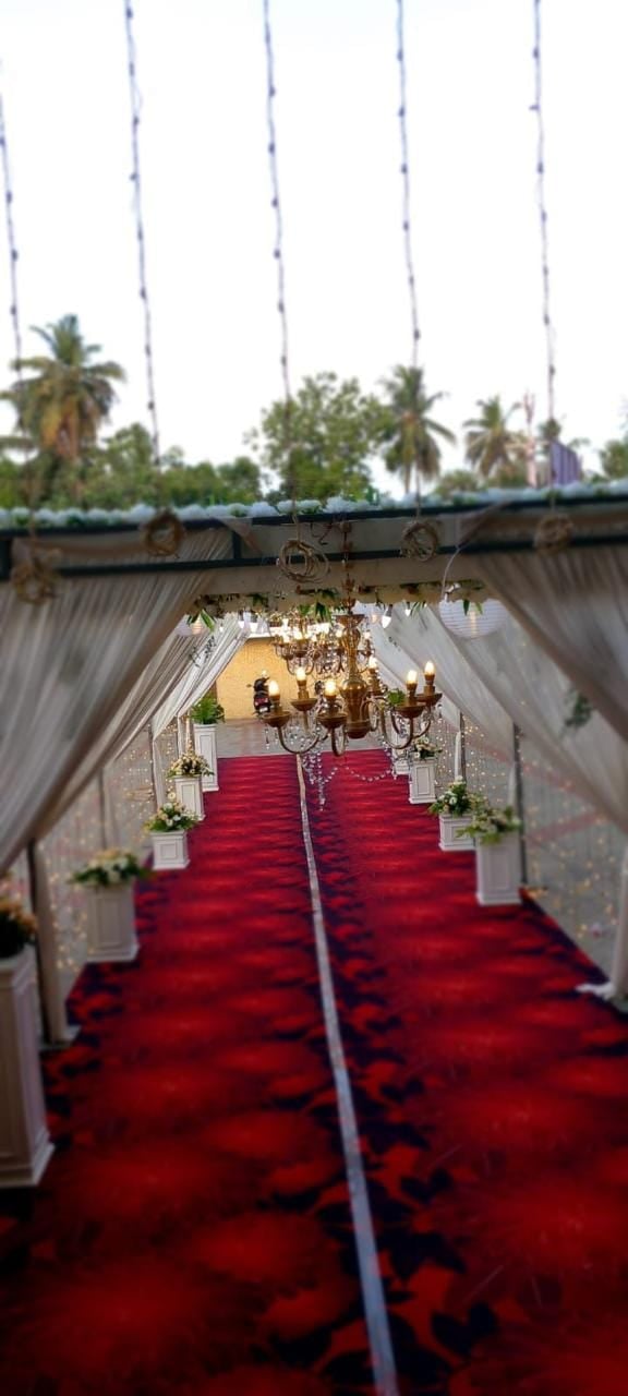 White canopy walkway with chandeliers