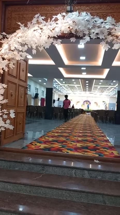Video: walking into the hall through the floral arch